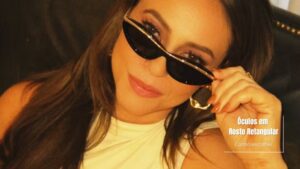 Mulher com óculos escuros em rosto retangular.